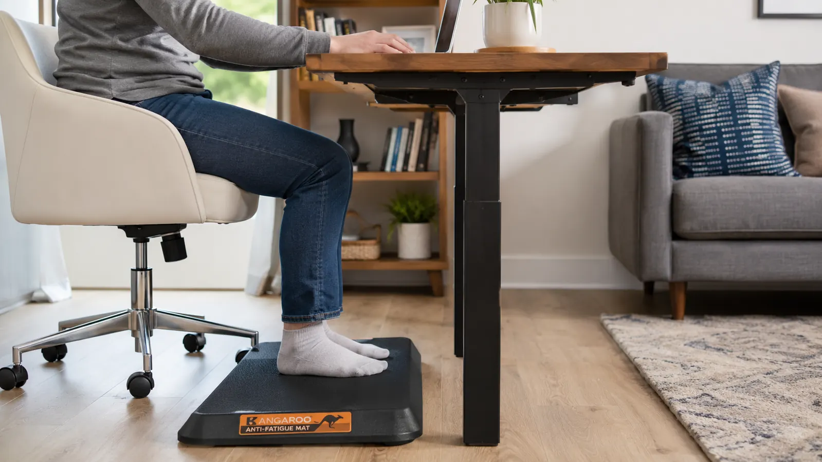 Side view of the KANGAROO mat on a hardwood floor showing the 3/4-inch thickness and beveled safety edge